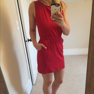 Red, open flutter back dress. Has pockets!